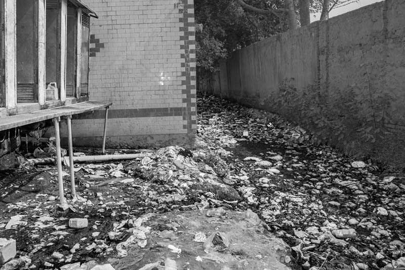 A mobile toilet block with its septic tank discharging the waste directly outside in open ground in Southeast district, National Capital Territory of Delhi